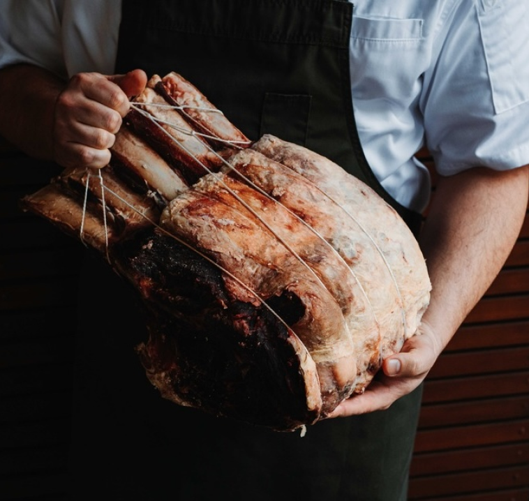 Chef holding beef